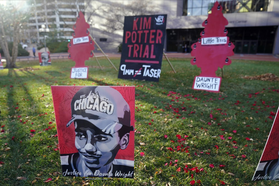 Posters stand on the south lawn Tuesday, Nov. 30, 2021 at the Hennepin County Government Center in Minneapolis where jury selection begins for former suburban Minneapolis police officer Kim Potter, who says she meant to grab her Taser instead of her handgun when she shot and killed motorist Daunte Wright. (AP Photo/Jim Mone)