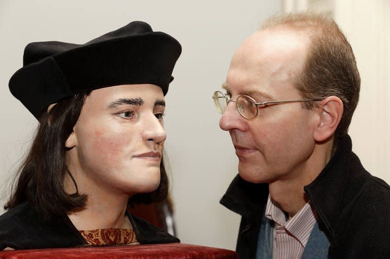 Michael Ibsen (R), a descendant of England's king Richard III, with a plastic model based on a CT scan of Richard's skull, during a press conference in London on February 5, 2013. The face of England's much-maligned Richard III was revealed on Tuesday for the first time in 500 years on Tuesday following a reconstruction of his skeleton which was found buried underneath a car park