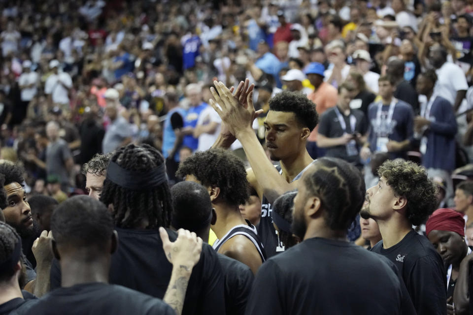 San Antonio Spurs' Victor Wembanyama reacts before an NBA summer league basketball game against the Portland Trail Blazers, Sunday, July 9, 2023, in Las Vegas. (AP Photo/John Locher)