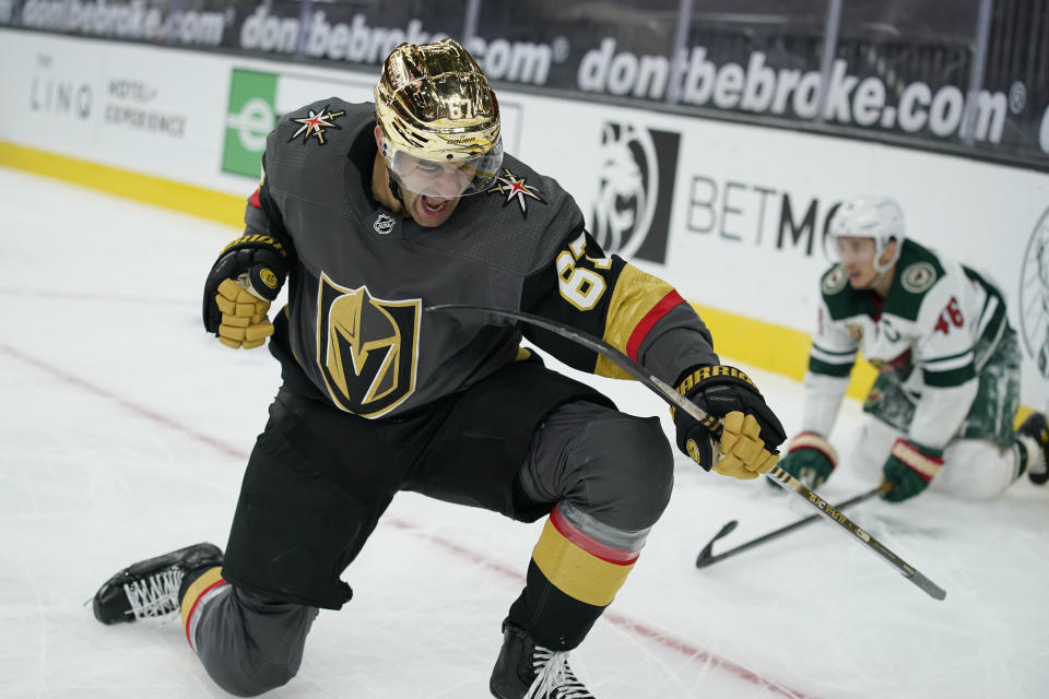 Vegas Golden Knights left wing Max Pacioretty (67) celebrates after scoring against the Minnesota Wild during overtime of an NHL hockey game Monday, March 1, 2021, in Las Vegas. (AP Photo/John Locher)