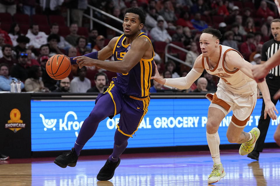 LSU guard Jordan Wright (6) is pursued by Texas guard Chendall Weaver during the second half of an NCAA college basketball game, Saturday, Dec. 16, 2023, in Houston. (AP Photo/Kevin M. Cox)