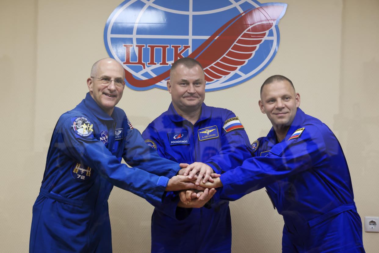 In this photo released by Roscosmos space corporation, NASA astronaut Don Pettit, left, Roscosmos cosmonauts Alexey Ovchinin, centre, and Ivan Vagner, crew members to the International Space Station, ISS, pose during a news conference on the eve of the launch in Russian leased Baikonur cosmodrome, Kazakhstan, Tuesday, Sept. 10, 2024. (Ivan Timoshenko, Roscosmos space corporation, via AP)