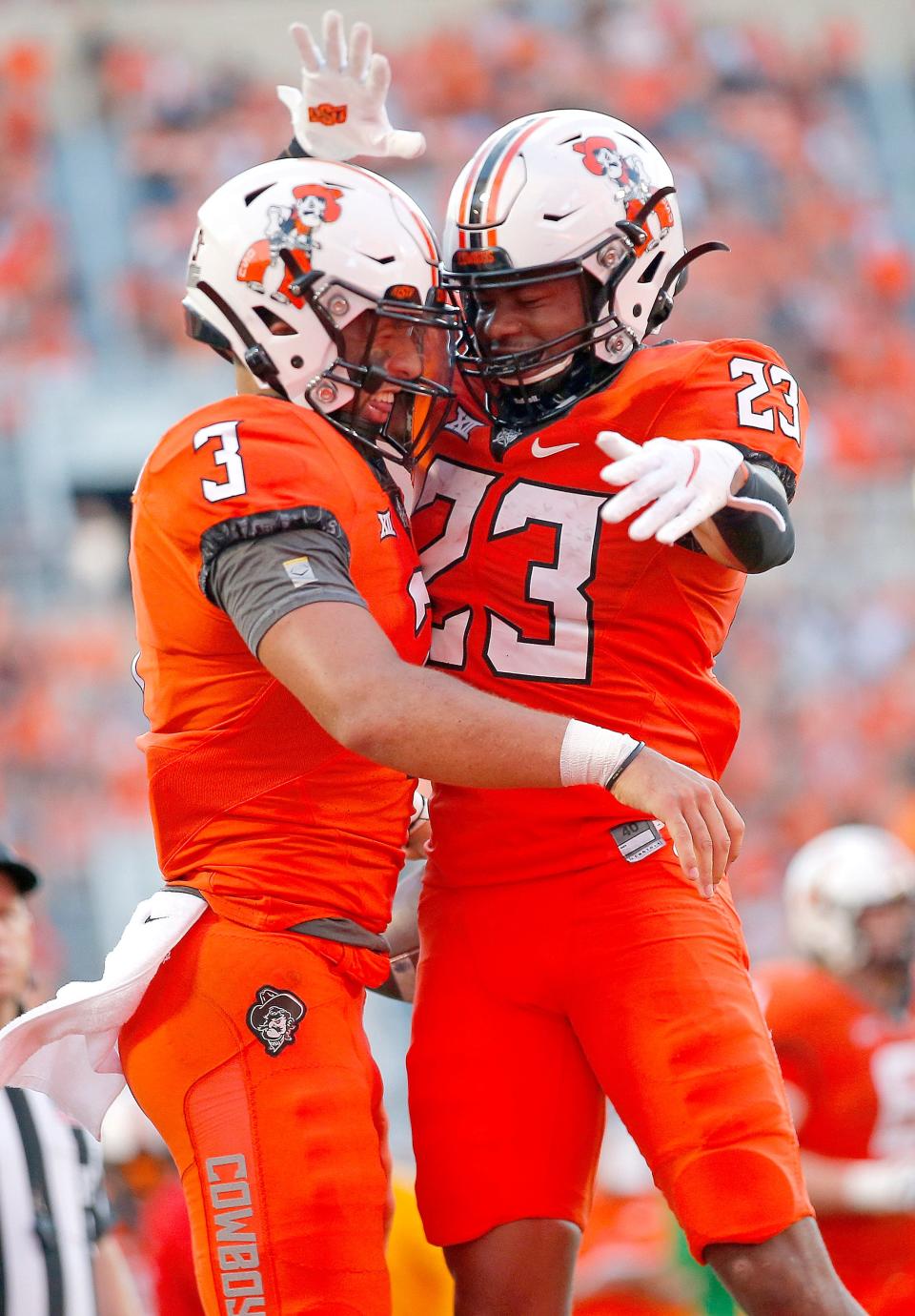 Sep 1, 2022; Stillwater, Oklahoma, USA; Oklahoma State Cowboys quarterback Spencer Sanders (3) celebrates his touchdown with Jaden Nixon (23) in a game against Central Michigan at Boone Pickens Stadium. Mandatory Credit: Sarah Phipps-USA TODAY Sports