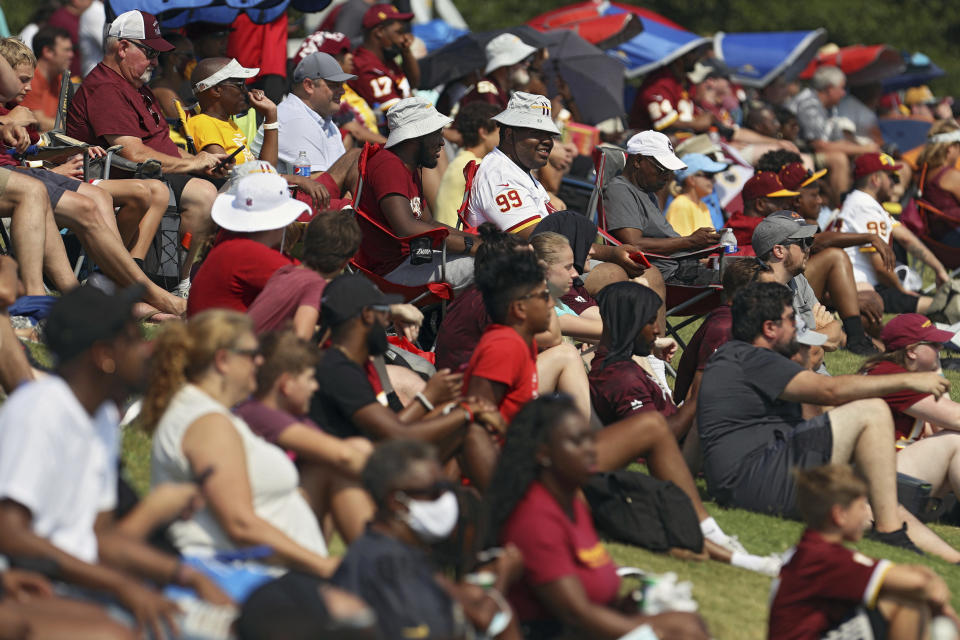 Washington Football Team fans watch drills during NFL football practice in Richmond, Va., Wednesday, July 28, 2021. (AP Photo/Ryan M. Kelly)