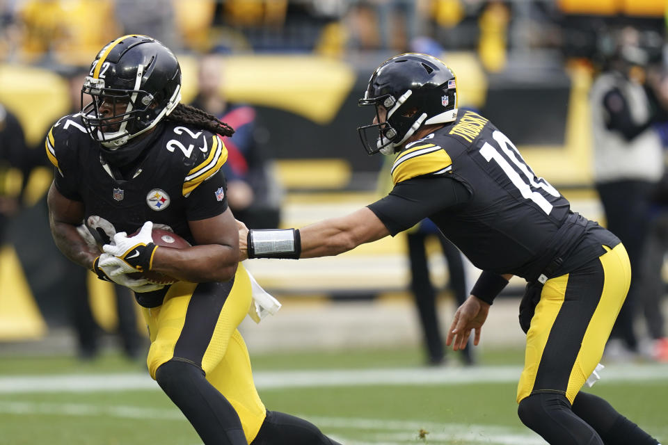 Pittsburgh Steelers quarterback Mitch Trubisky (10) hands the ball off to Steelers running back Najee Harris (22) during the first half of an NFL football game against the Arizona Cardinals. Sunday, Dec. 3, 2023, in Pittsburgh. (AP Photo/Matt Freed)