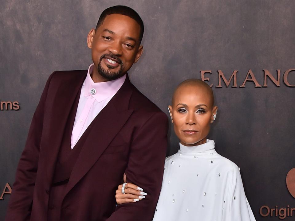 Will Smith and Jada Pinkett Smith pose together at a premiere.