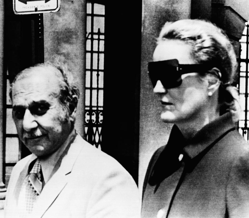 FILE - Heiress Doris Duke, right, and her attorney Aram Arabian, leave Superior Court on June 17, 1971, in Providence, R.I. When Duke, the fabulously wealthy tobacco and power company heir, ran over and killed longtime employee and confidant Eduardo Tirella at her Newport, R.I., mansion in 1966, many people never bought the official police report that the death was an "unfortunate accident." But the city manager in Newport, R.I., is standing by the city police department's review of the 1966 death of the employee of Duke, and found, like the original investigation, it was all an accident. (AP Photo/File)