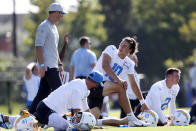 Los Angeles Chargers quarterback Justin Herbert (10) talks with head coach Brandon Staley during practice at the NFL football team's training camp in Costa Mesa, Calif., Wednesday, July 28, 2021. (AP Photo/Alex Gallardo)