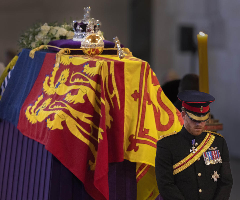 Prince Harry was allowed to wear military uniform when he stood vigil over his grandmother's coffin. (AP)