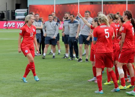 England forward Toni Duggan (18) dances a gig for teammates following their defeat of Germany in the third place match of the FIFA 2015 Women's World Cup at Commonwealth Stadium. England defeated Germany 1-0 in extra time. Mandatory Credit: Erich Schlegel-USA TODAY Sports