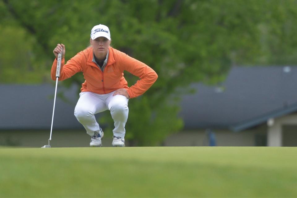 Fossil Ridge golfer Olivia Steen lines up a putt at the Class 5A high school girls golf state tournament at the Olde Course in Loveland on  June 1.