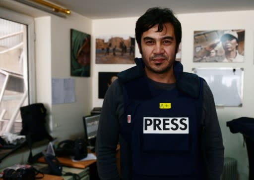 Sardar Ahmad, a Kabul-based staff reporter at the Agence France-Presse poses for a photo hours before he, his wife and two of his three children were gunned down at the Serena hotel