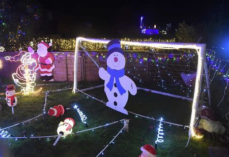 A home is decorated with a display of Christmas of lights in a tradition that has grown over recent years in the small village of Westfield in Sussex, south east England, December 15, 2016. Picture taken on December 15. REUTERS/Toby Melville