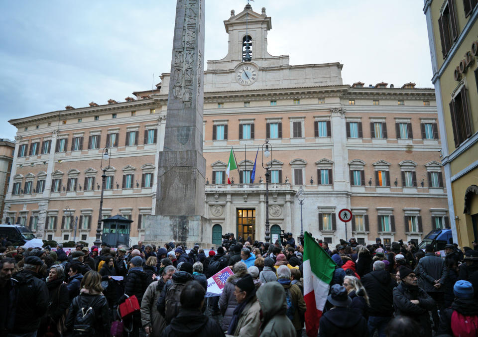 Protesters gather during a demonstration in support of German humanitarian group Sea-Watch, in front of the Italian lower chamber’s Montecitorio palace, in Rome, Monday, Jan. 28, 2019. A Sea-Watch rescue ship that picked up 47 migrants off the Libyan coasts on Jan. 19, was allowed to shelter in the Italian territorial waters due to threatening weather last Thursday, but the government refuses to let aid groups disembark the migrants in Italian ports. (AP Photo/Andrew Medichini)