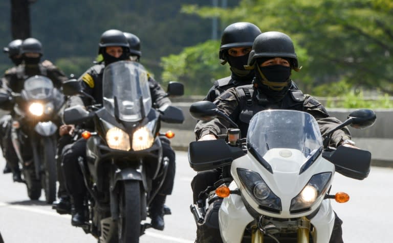 Venezuelan police patrol Caracas during an operation to capture Oscar Perez, the Venezuelan helicopter pilot who dropped grenades on the Supreme Court last year during anti-government protests