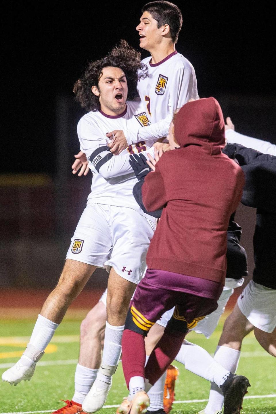 Las Lomas player Nathan Palavos (16) celebrates with teammates after defeating the Golden Valley Cougars 3-1 in penalty kicks during a NorCal Regional playoff game at Golden Valley High School in Merced, Calif., on Tuesday, Feb. 27, 2024.