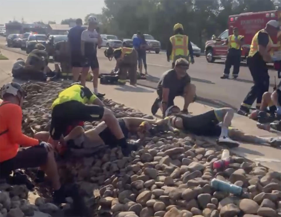 This photo provided by Tony Quinones shows the aftermath of a truck ramming into a crowd of bikers Saturday, June 19, 2021, in Show Low, Ariz. Authorities in the small city of Show Low said the unidentified 35-year-old male suspect fled the crash scene in the pickup and was shot and wounded by officers a short time later. Of the seven cyclists hospitalized, six were in critical condition, and one was in stable condition on Sunday, June 20, 2021, police said in a statement. (Tony Quinones via AP)