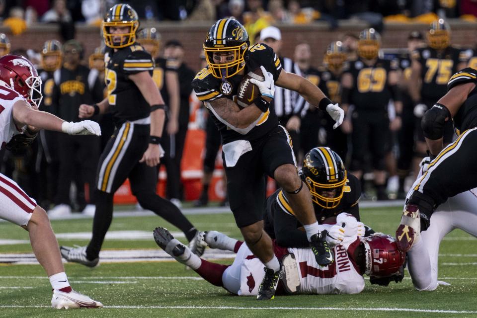 Missouri running back Cody Schrader runs the ball during the third quarter of an NCAA college football game against Arkansas Friday, Nov. 25, 2022, in Columbia, Mo. | L.G. Patterson, Associated Press