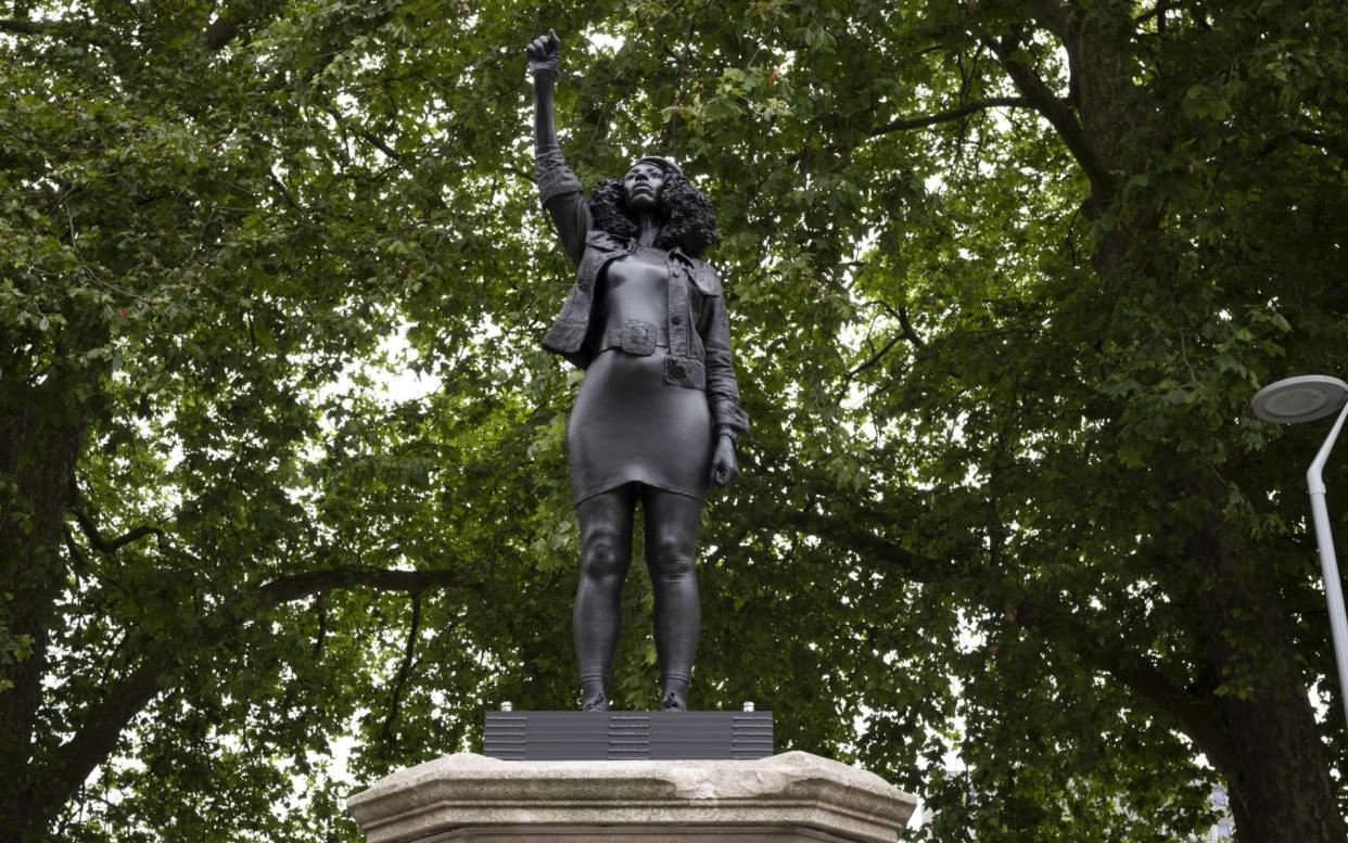  new sculpture, by local artist Marc Quinn, of Black Lives Matter protestor Jen Reid stands on the plinth where the Edward Colston statue used to stand  - Getty Images Europe 