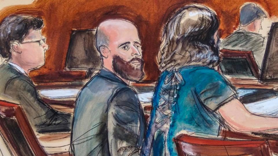 PHOTO: In this courtroom sketch, Joshua Schulte, center, is seated at the defense table flanked by his attorneys during jury deliberations, March 4, 2020, in New York. (Elizabeth Williams via AP)