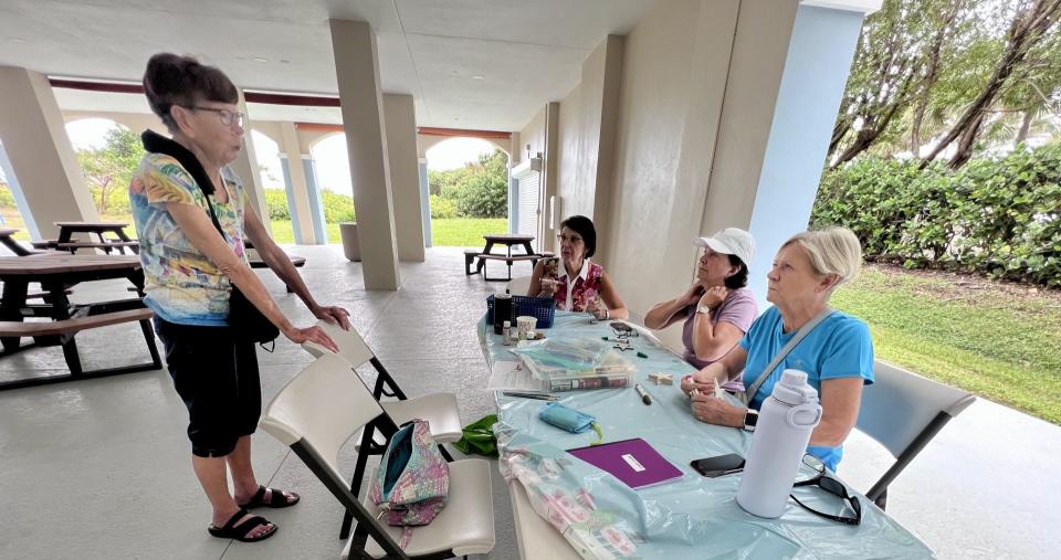 Seasiders President Chris Mielke (left) speaks with women at the Palm Beach Shores community center who are preparing for an annual holiday bazaar in November 2023. The Seasiders is a non-profit women's organization founded by five Palm Beach Shores residents in 1951.