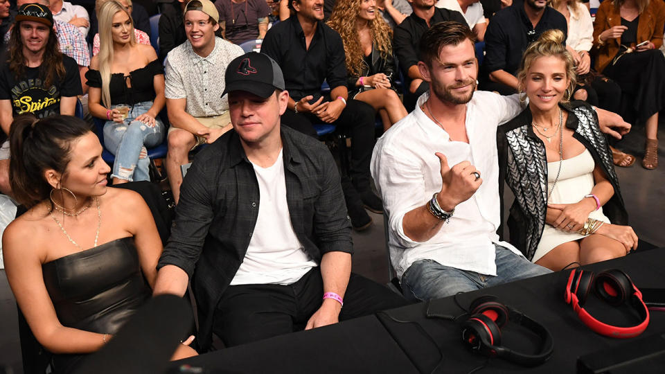 Matt Damon and Chris Hemsworth with their wives. (Photo by Jeff Bottari/Zuffa LLC/Zuffa LLC via Getty Images)