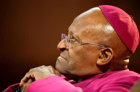 The former Anglican archbishop of Cape Town Desmond Tutu waits to receive the 2013 Templeton Prize at the Guildhall in central London on May 21, 2013. REUTERS/Paul Hackett/File Photo