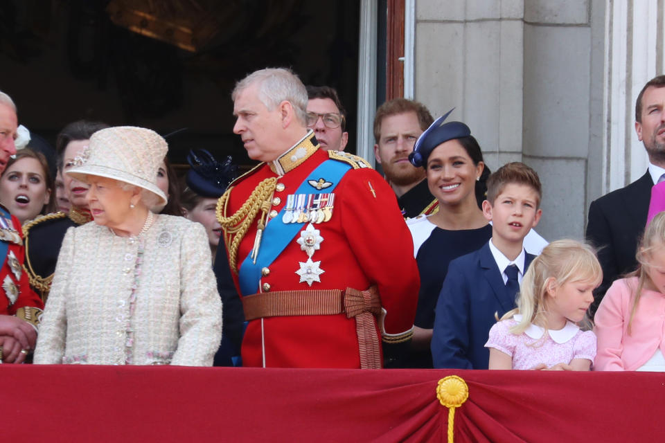 Harry and Meghan were barely visible tucked behind other royal faces. Photo: Getty Images