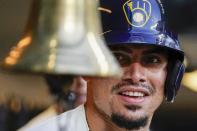 Milwaukee Brewers' Willy Adames rings a bell after hitting a two-run home run during the first inning of a baseball game against the St. Louis Cardinals Tuesday, June 21, 2022, in Milwaukee. (AP Photo/Morry Gash)