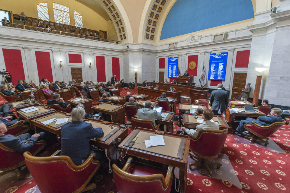 FILE - In this Monday, Aug. 20, 2018, file photo, the state Senate convenes a special session to begin impeachment proceedings against several state Supreme Court Justices. Twenty candidates are running for two Supreme Court seats in West Virginia, where four justices were impeached by the Republican House following questions about costly renovations that evolved into accusations of corruption, incompetence and neglect of duty. (Craig Hudson/Charleston Gazette-Mail via AP, File)