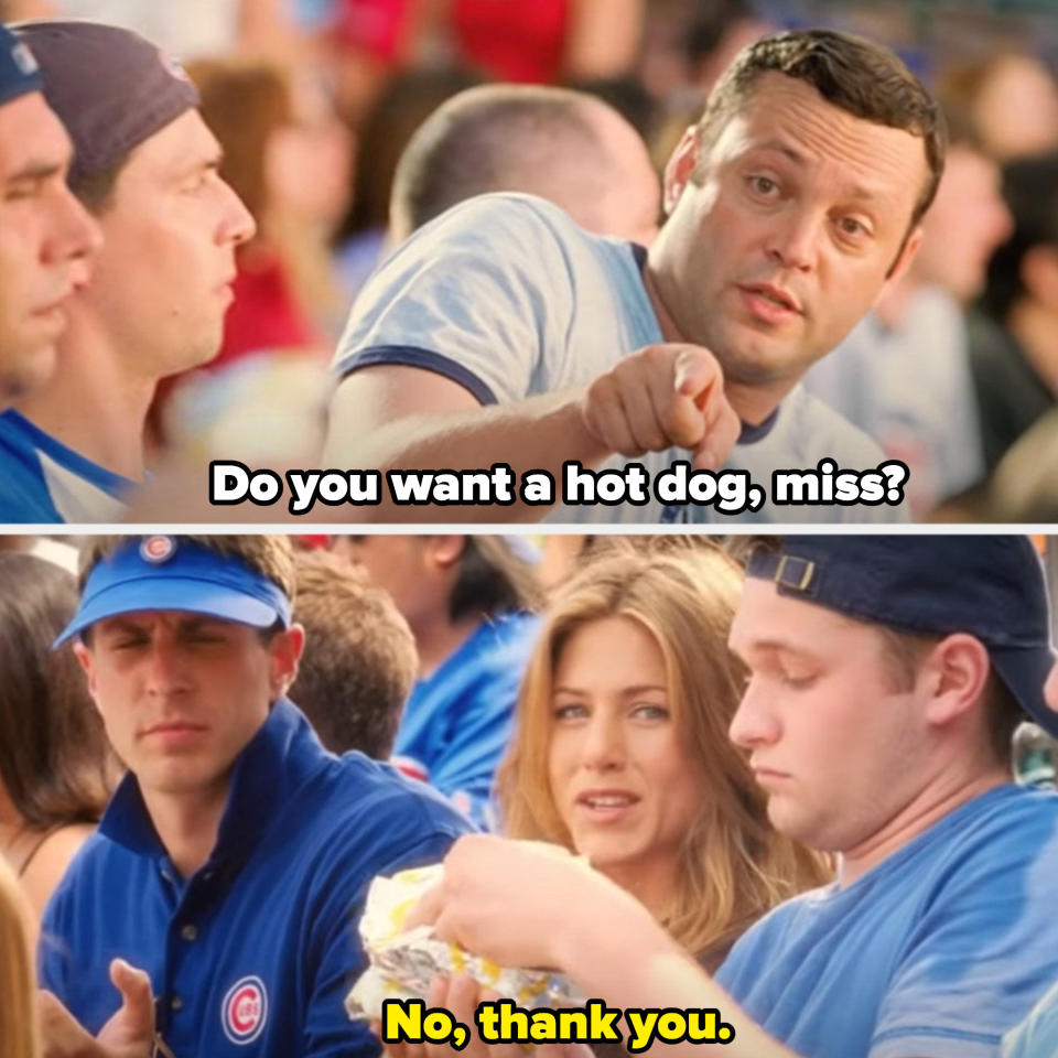 Gary offering Brooke a hot dog at a Chicago Cubs baseball game