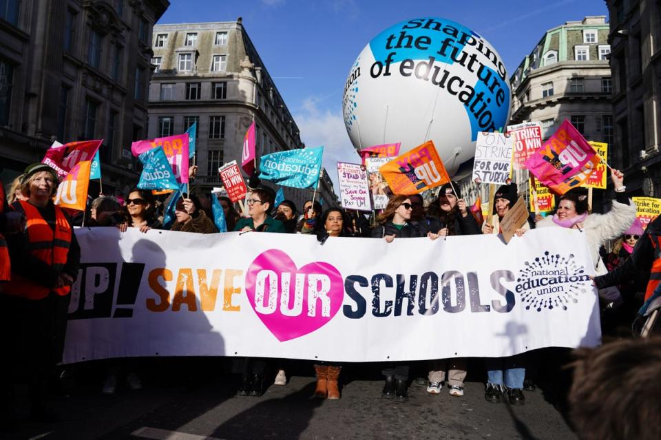 Members of the National Education Union (NEU) take part in a march from Portland Place to Westminster where they will gather for rally against the Government’s controversial plans for a new law on minimum service levels during strikes (PA)
