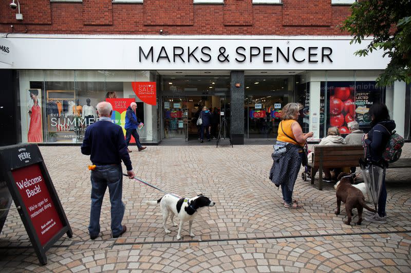 FILE PHOTO: People are seen outside a Marks and Spencer (M&S) store, in Altrincham