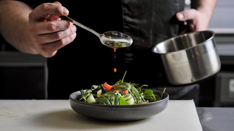 Professional chef making salad