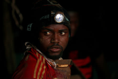 A rescue worker moves out from a shaft as retrieval efforts proceed for trapped artisanal gold miners near Kadoma, Zimbabwe, February 16, 2019, REUTERS/Mike Hutchings