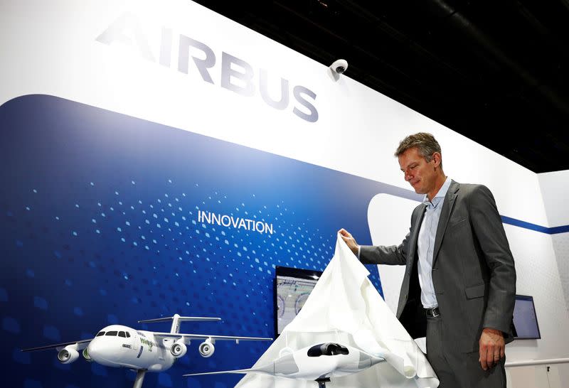 Airbus' Executive Vice President of Engineering Jean-Brice Dumont unveils a model of the MAVERIC aircraft at the Singapore Airshow in Singapore