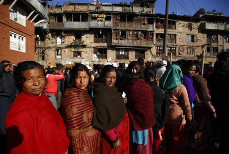 Nepalese people stand in a queue outside a polling station to cast their votes during the Constituent Assembly Election in Bhaktapur November 19, 2013. REUTERS/Navesh Chitrakar