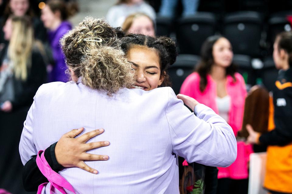 Southeast Polk's Skylar Slade gets an embraces from Charlotte Bailey after her match at 155 pounds in the finals during the IGHSAU state girls wrestling tournament, Friday, Feb. 3, 2023, at the Xtream Arena in Coralville, Iowa.