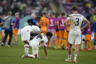 U.S. players react at the end of the World Cup round of 16 soccer match between the Netherlands and the United States, at the Khalifa International Stadium in Doha, Qatar, Saturday, Dec. 3, 2022. (AP Photo/Natacha Pisarenko)