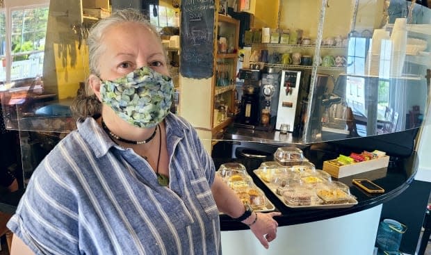 Pam McNeill says while it's 'hectic,' her staff have figured out a way to work alongside the Soaring Crane Sushi team for the hour that they cross over in their small kitchen. (Haley Ryan/CBC - image credit)