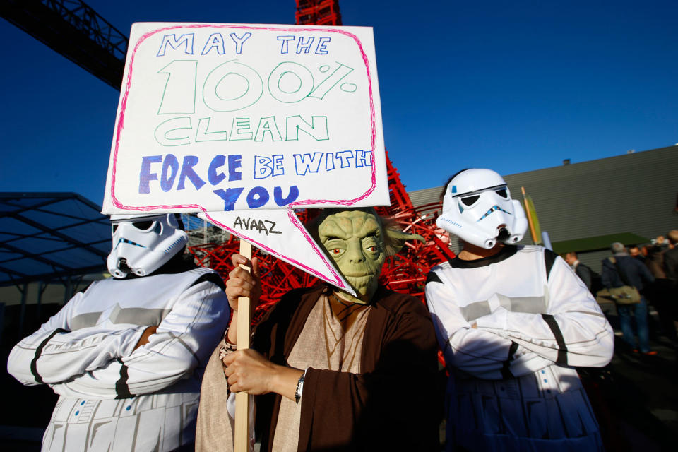 <p>Global citizen’s movement Avaaz in a Star Wars themed stunt with Yoda and two storm-troopers pose during a protest for Paris climate agreement to put the world on course for clean energy front of the mini red Eiffel Tower replica during the COP21, United Nations Climate Change Conference in Le Bourget, north of Paris, France, Wednesday, Dec. 9, 2015. (AP Photo/Francois Mori) </p>