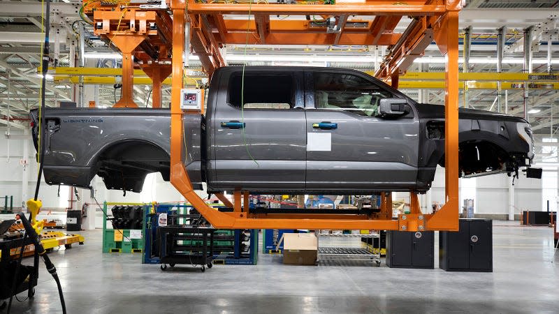 A photo of a Ford F-150 Lightning body on the factory floor. 