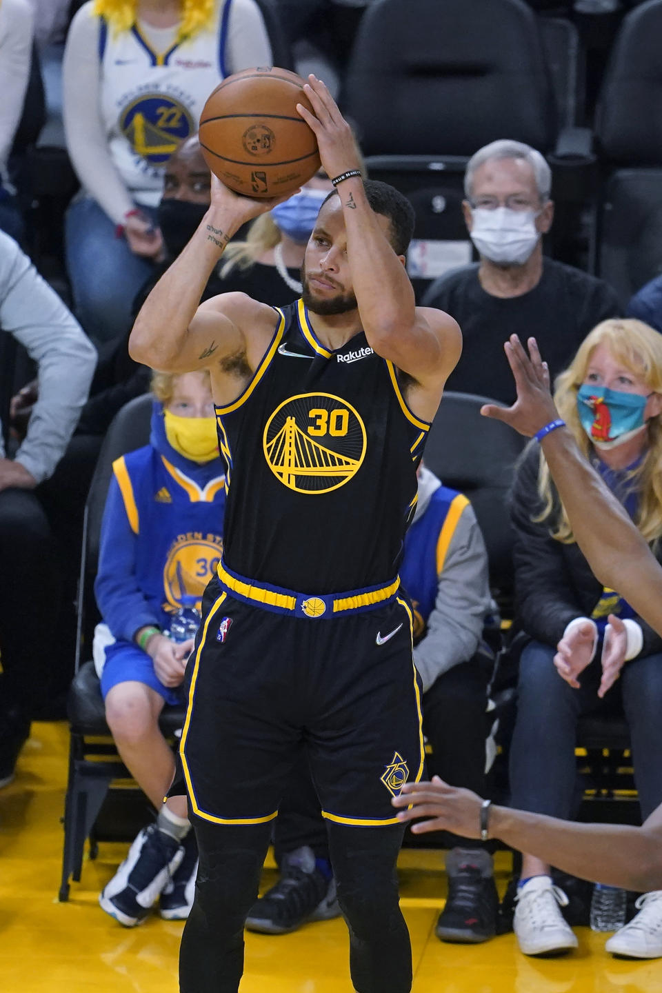 Golden State Warriors guard Stephen Curry (30) attempts a 3-point basket, which he did not make, during the first half of the team's NBA basketball game against the Portland Trail Blazers in San Francisco, Wednesday, Dec. 8, 2021. (AP Photo/Jeff Chiu)