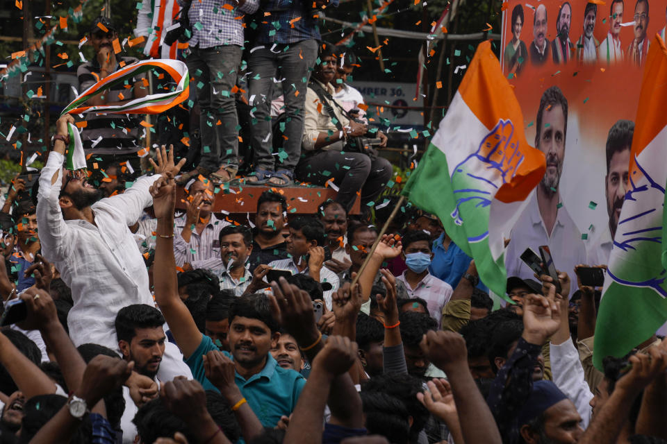 Supporters of India's main opposition party, Indian National Congress, celebrate early leads for their party in Telangana state elections in Hyderabad, India, Sunday, Dec.3, 2023. India’s Hindu nationalist party was headed for a clear win in three out of four states Sunday, according to the election commission’s website. (AP Photo/Mahesh Kumar A)