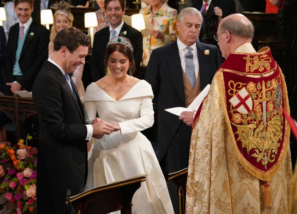 Jack Brooksbank puts the ring on Prince Eugenie's finger.