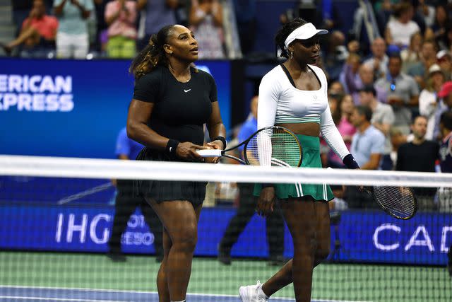 Elsa/Getty (Left-right:) Serena Williams and Venus Williams in 2022