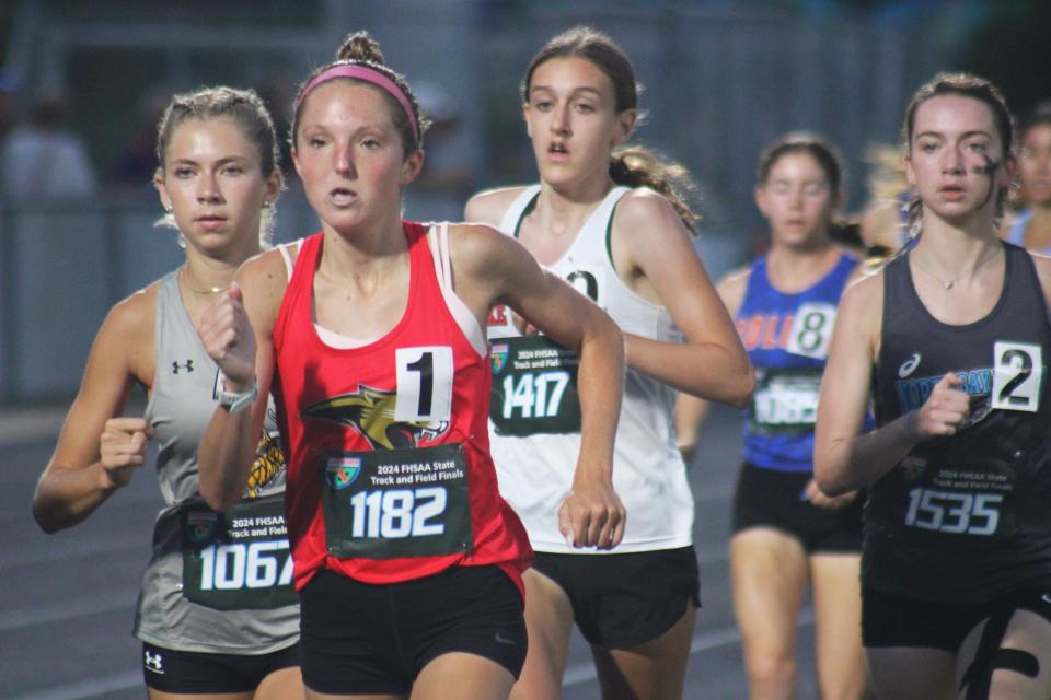 Addison Dempsey (1182) of Cardinal Mooney leads a pack of runners in the girls 3,200-meter race during the FHSAA Class 2A high school track & field championships in Jacksonville on May 16, 2024. [Clayton Freeman/Florida Times-Union]