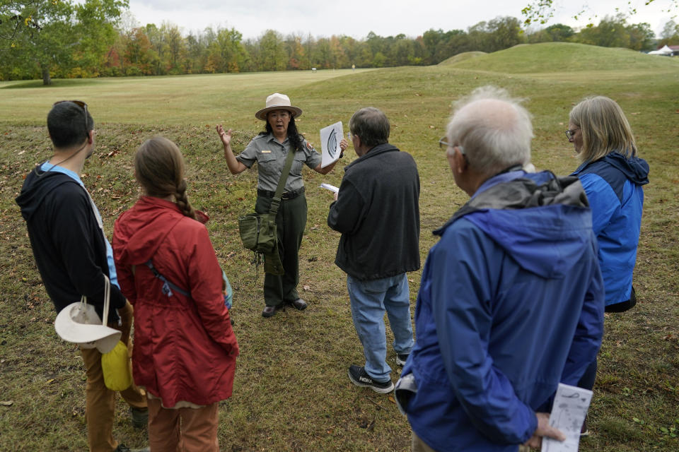 Park Ranger Myra Vick guides a tour of the Mound City Group at Hopewell Culture National Historical Park in Chillicothe, Ohio, Saturday, Oct. 14, 2023, before the Hopewell Ceremonial Earthworks UNESCO World Heritage Inscription Commemoration ceremony. A network of ancient American Indian ceremonial and burial mounds in Ohio noted for their good condition, distinct style and cultural significance, including Hopewell, was added to the list of UNESCO World Heritage sites. (AP Photo/Carolyn Kaster)