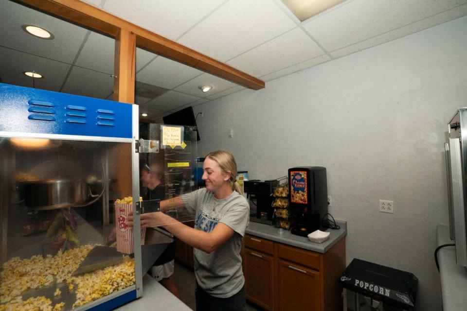 Employee Sadie Ziegler fills a bag of popcorn at the Belleville Sportsplex concession stand. The City Council voted Monday night to give the business a special-use permit for a liquor license.