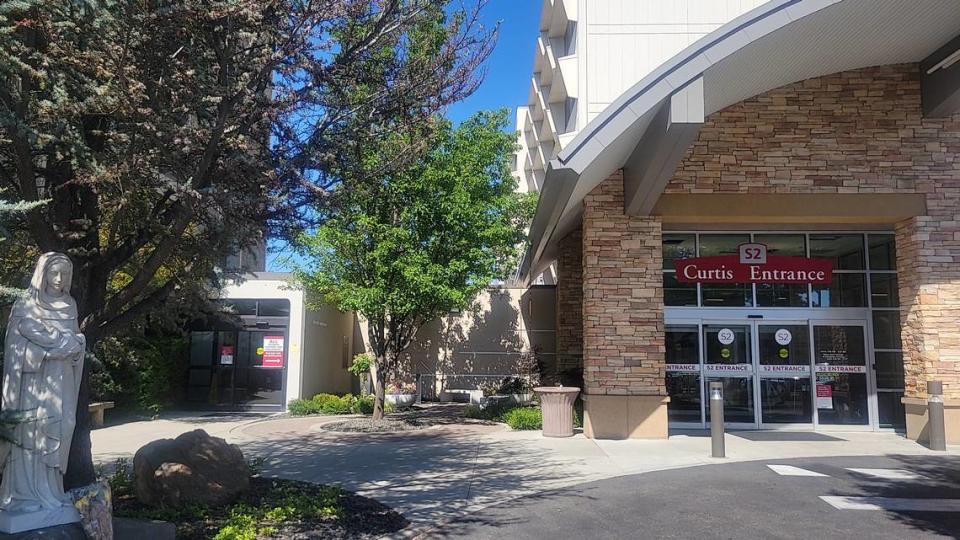 The COVID-19 memorial garden, left, at Saint Alphonsus Health System’s Boise location. The memorial is titled “Is Where the Angels Are-.”